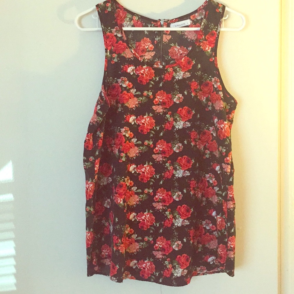 Black tank top with red flowers.